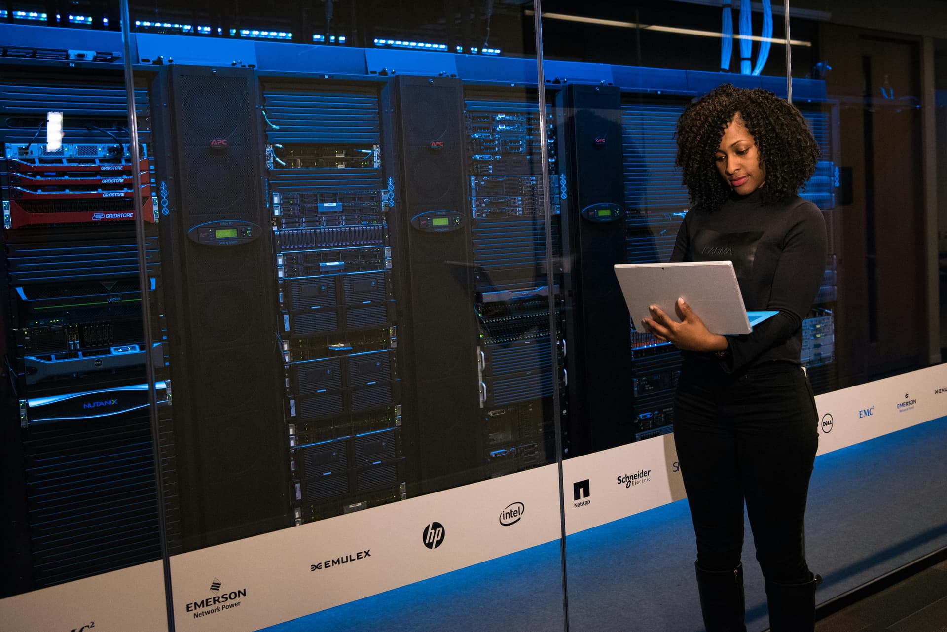 Enterprise AI implementation framework in action - data center professional managing AI infrastructure for business transformation and scalable deployment