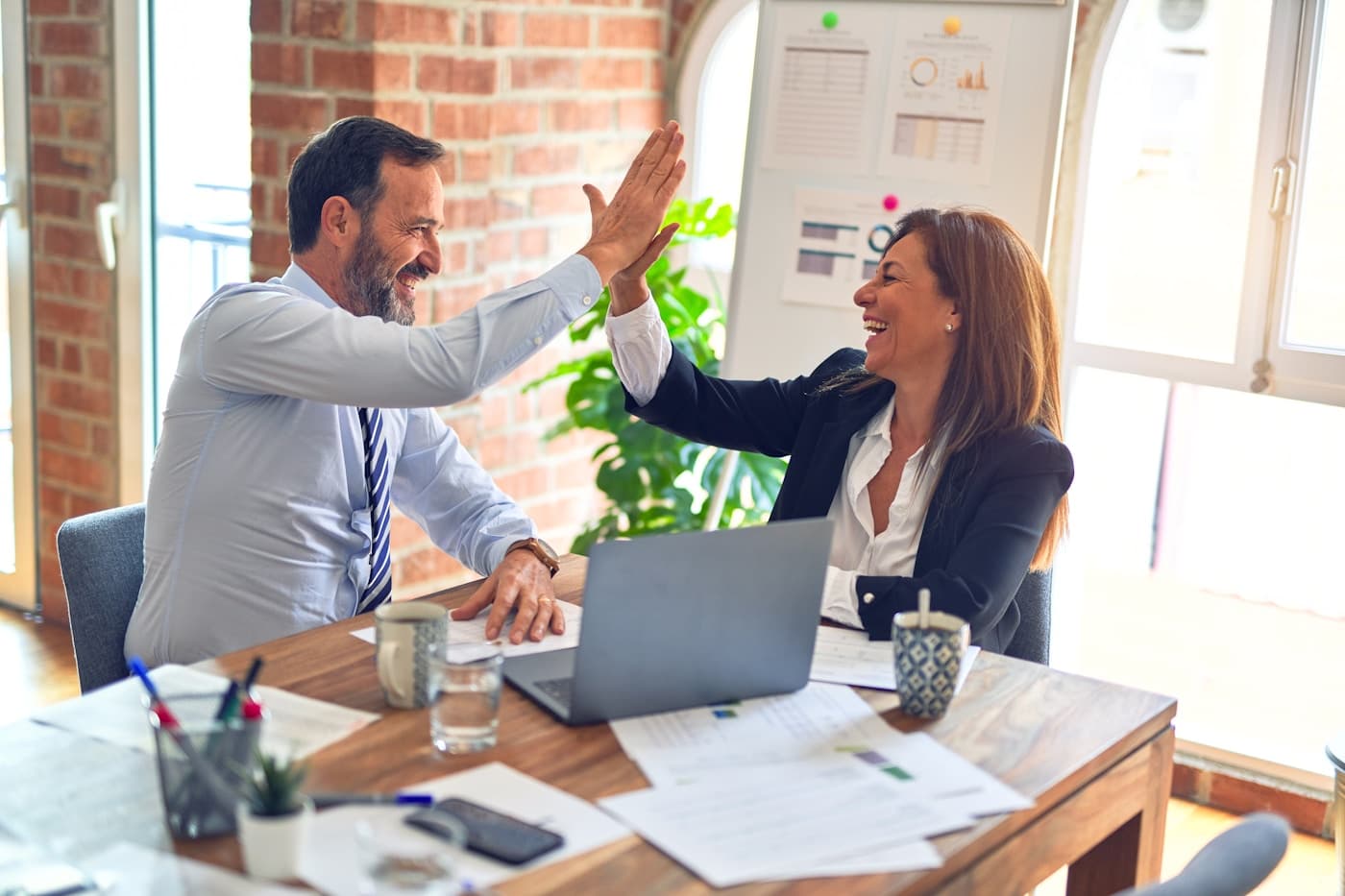 Business team collaborating in a modern office, representing production AI governance and strategy